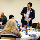 Yang talks with local Democrats during the Boone County Democracy Ball.